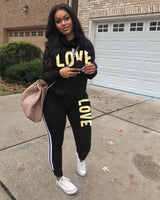 Damen nan sportives Kapuzen-Sweatshirt-Set mit Goldprint und Highwaist-Jogginghose Drune in Schwarz
