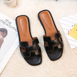Damen Ledersandalen Soleil | Flache Sandalen mit H-Riemen in Schwarz
