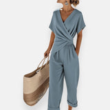 Elegantes Damen-Set mit Kreuzdesign und weiter Hose in Blau