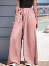 Damen nan weite Palazzo-Hose mit hohem Paperbag-Bund, elastischem Tunnelzug und vorderer Beinschlitz Drune in Rosa