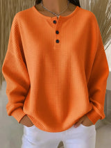Damen nan Oversized Waffelstrick Henley-Pullover mit Knopfleiste und abgerundetem Saum Drune in Orange