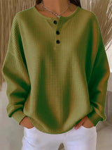 Damen nan Oversized Waffelstrick Henley-Pullover mit Knopfleiste und abgerundetem Saum Drune in Olivgrün