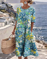 Xenjia | Lockeres Midikleid mit buntem Blumenprint in Blau